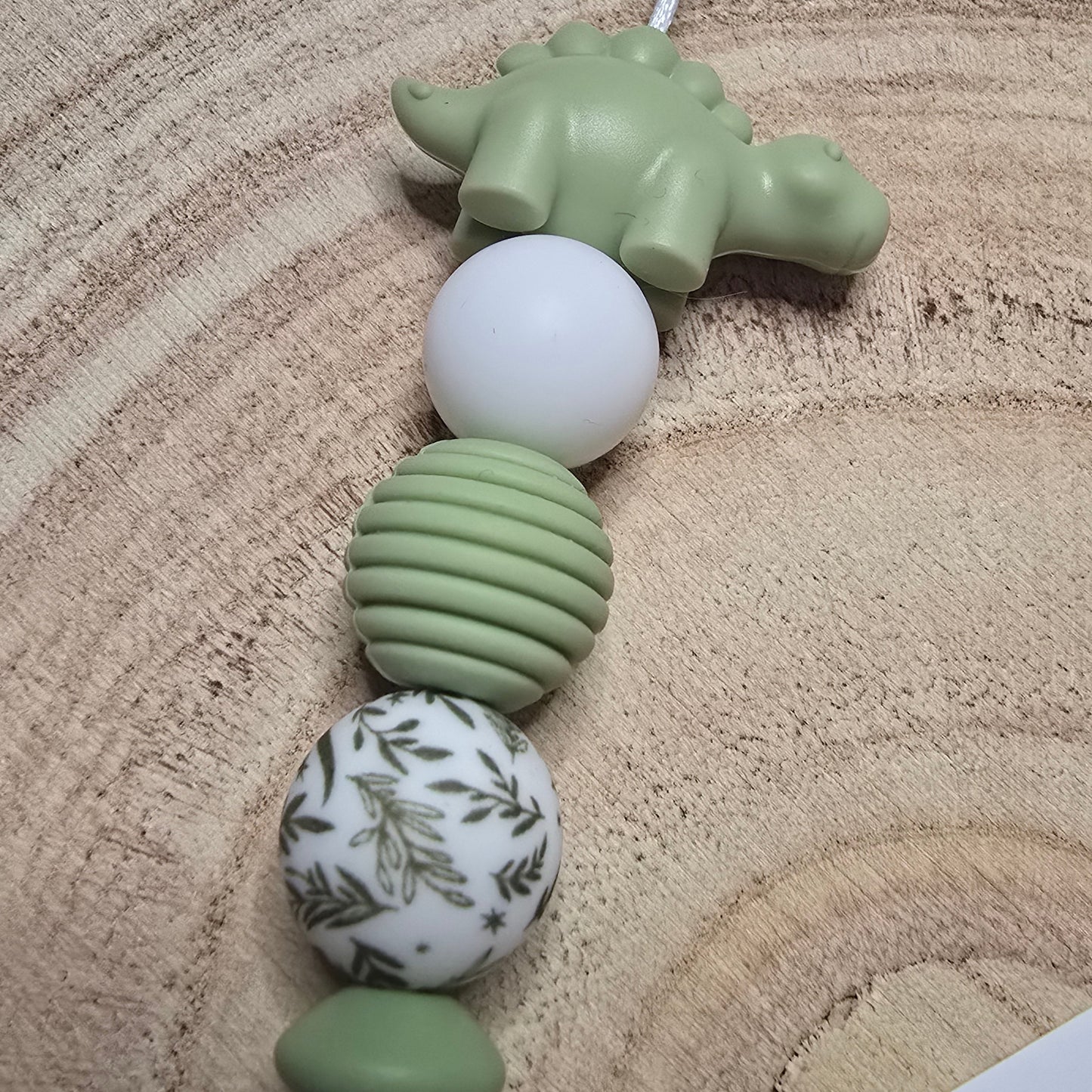Attache-tétine personnalisée Modèle Milo dino nature