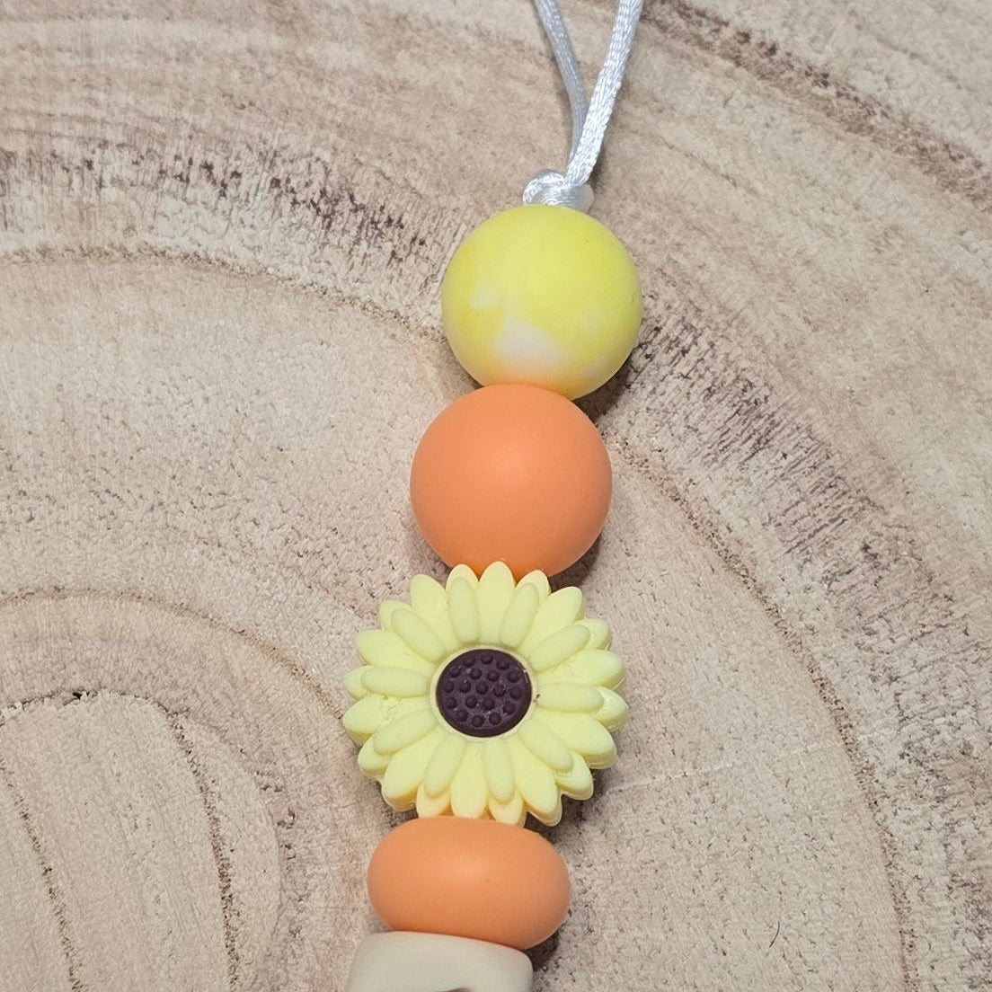 Attache-tétine personnalisée Modèle Alma Tournesols